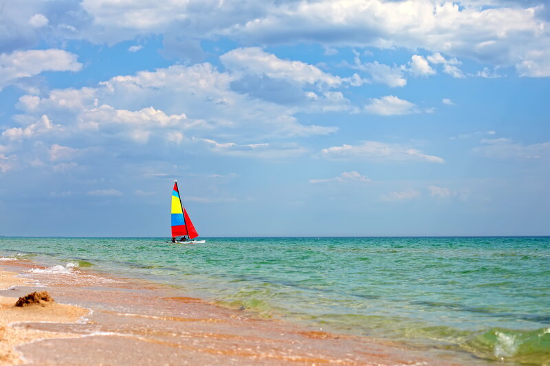 Sailboat on Ocean — Blue, Serene, Afternoon, Photograph, Beach, Sky
