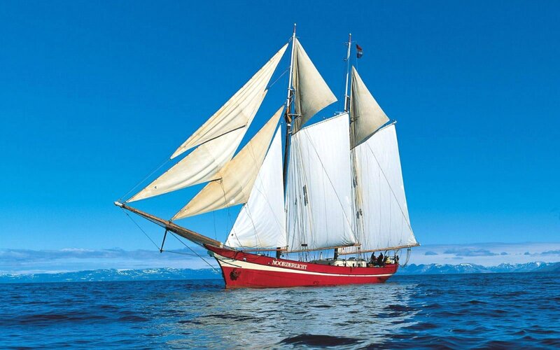 Sailboat on Ocean — Blue, Serene, Afternoon, Photograph, Mountains, Sky