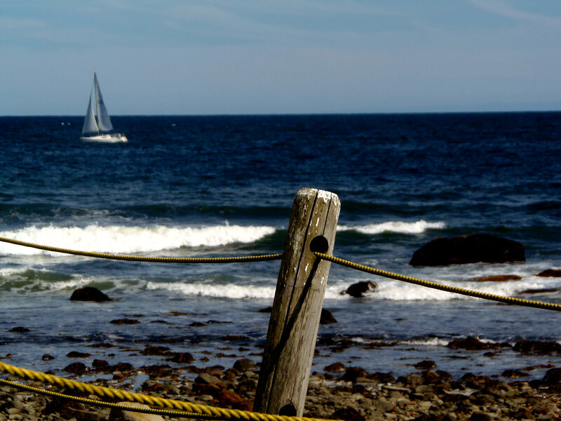 Sailboat on Ocean — Blue, Serene, Afternoon, Photograph, Rocks