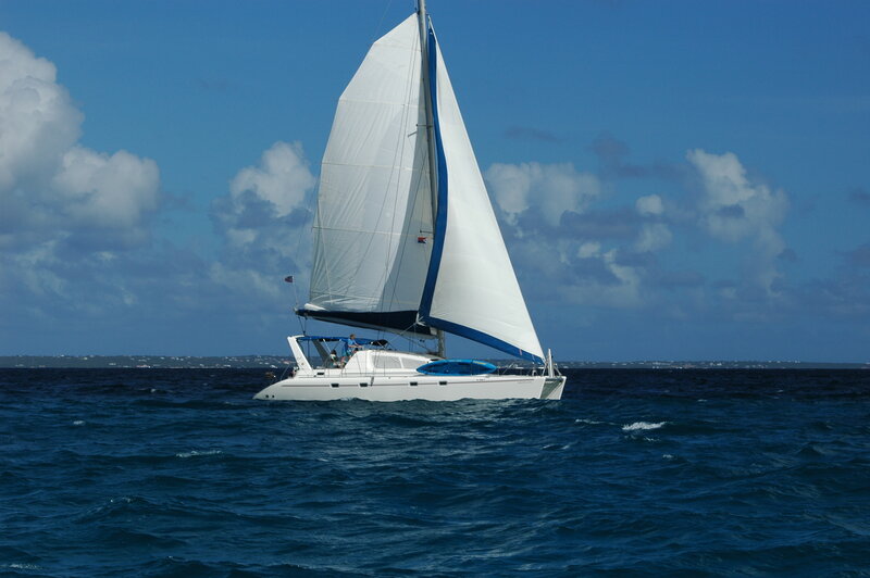 Sailboat on Ocean — Blue, Serene, Afternoon, Photograph, Sky, Clouds, White