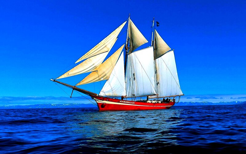 Sailboat on Ocean — Blue, Serene, Afternoon, Photograph, Sky, Mountains