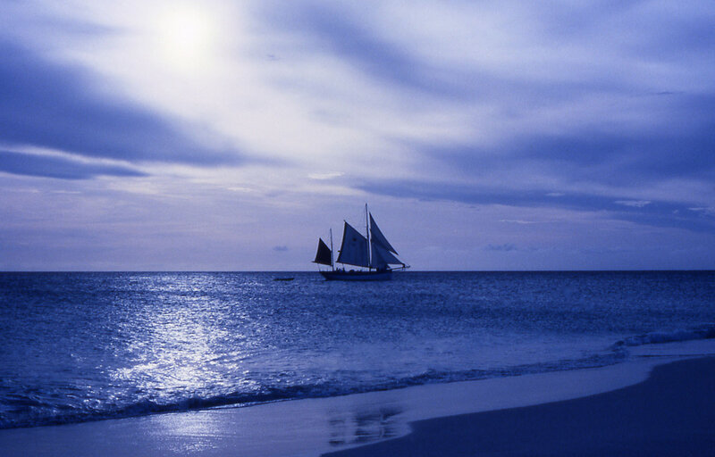 Sailboat on Ocean — Blue, Serene, Night, Photograph