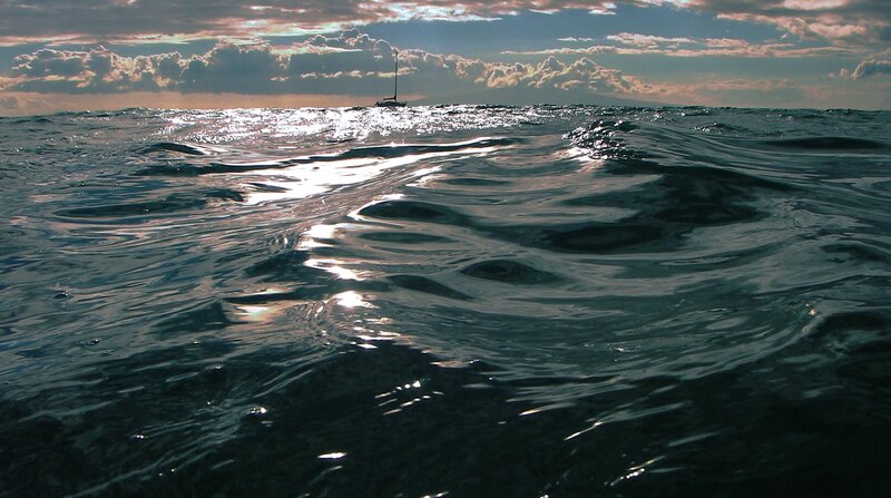 Sailboat on Ocean — Blue, Serene, Sunset, Photograph