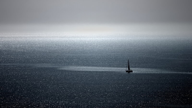 Sailboat on Ocean — Gray, Serene, Photograph
