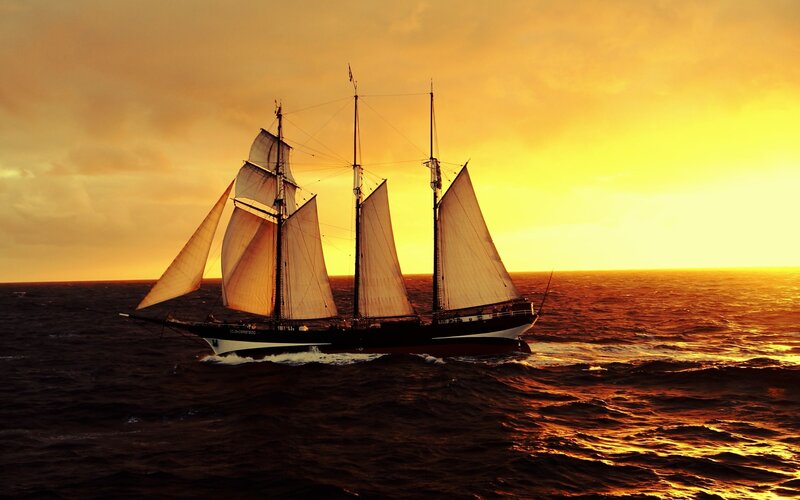 Sailboat on Ocean — Orange, Dramatic, Sunset, Photograph, Sky