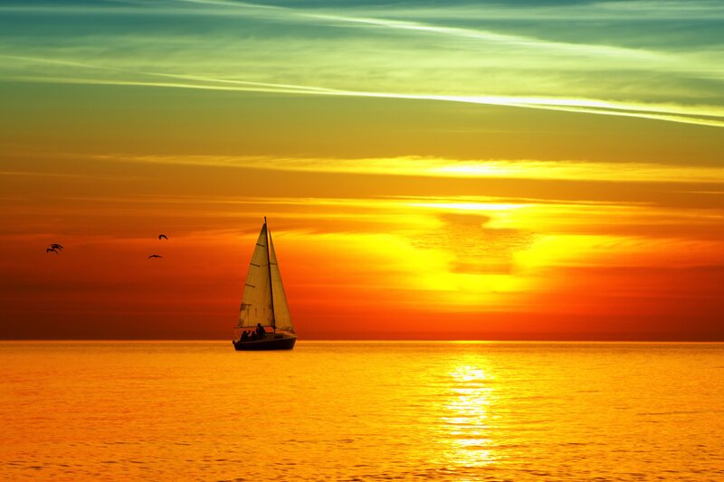 Sailboat on Ocean — Orange, Serene, Sunset, Photograph, Birds, Sun, Sky