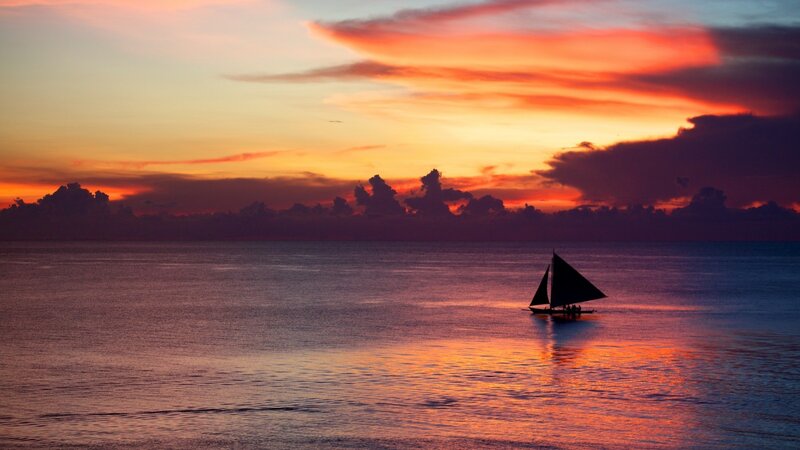 Sailboat on Ocean — Orange, Serene, Sunset, Photograph, Sky, Clouds