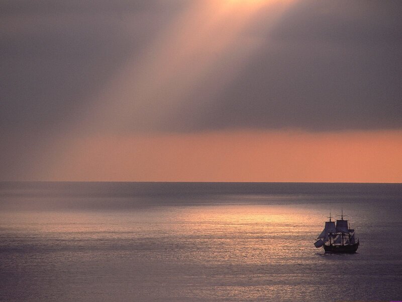 Sailboat on Ocean — Orange, Serene, Sunset, Photograph, Sky, Sunbeams