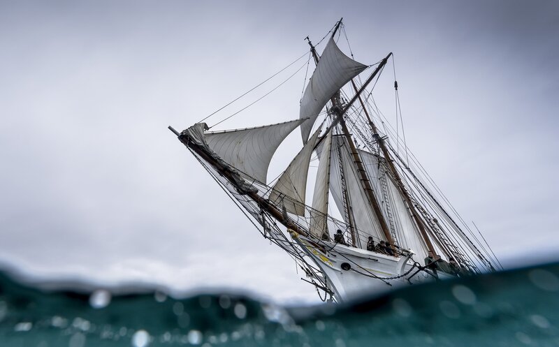 Sailboat on Ocean — White, Dramatic, Photograph