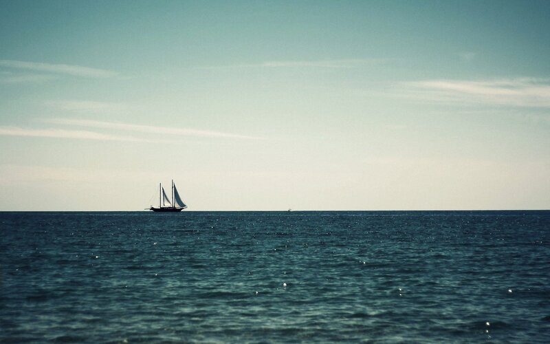 Sailboat on Open Sea — Clouds