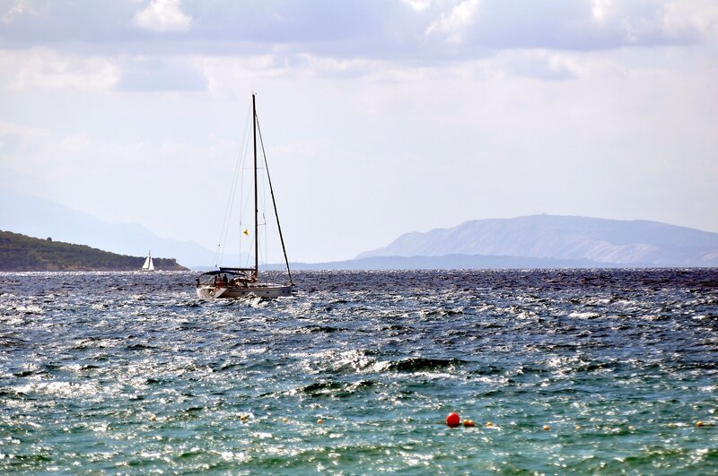 Sailboat on the Sea — Blue, Serene, Afternoon, Photograph, Mountains