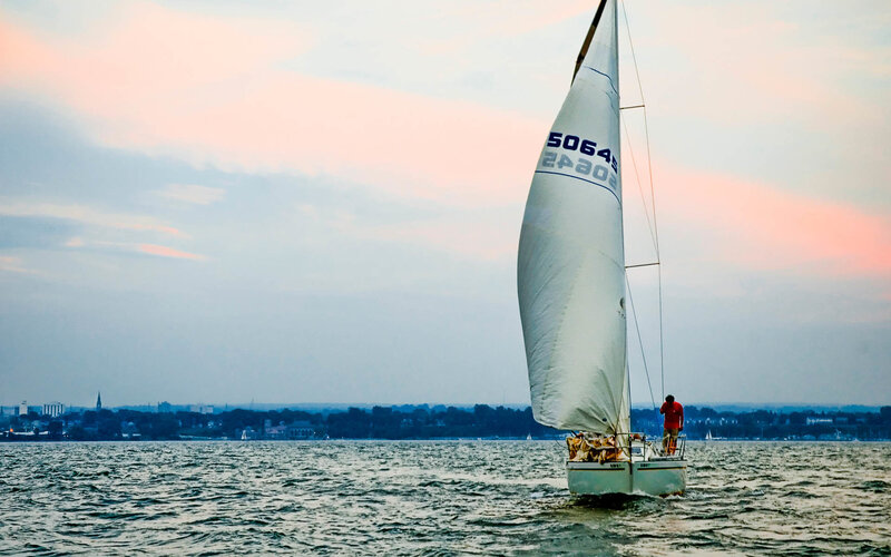 Sailboat on the water at dusk