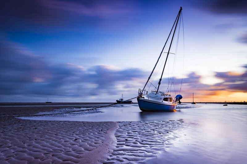 Sailboat on Tidal Flat — Blue