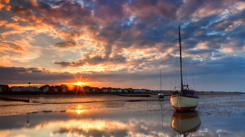 Sailboat on Tidal Flats — Orange, Dramatic