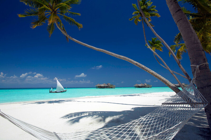 Sailboat on Tropical Beach — Blue, Serene, Afternoon, Photograph