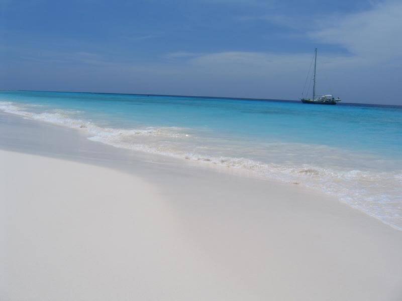 Sailboat on Tropical Beach — Blue