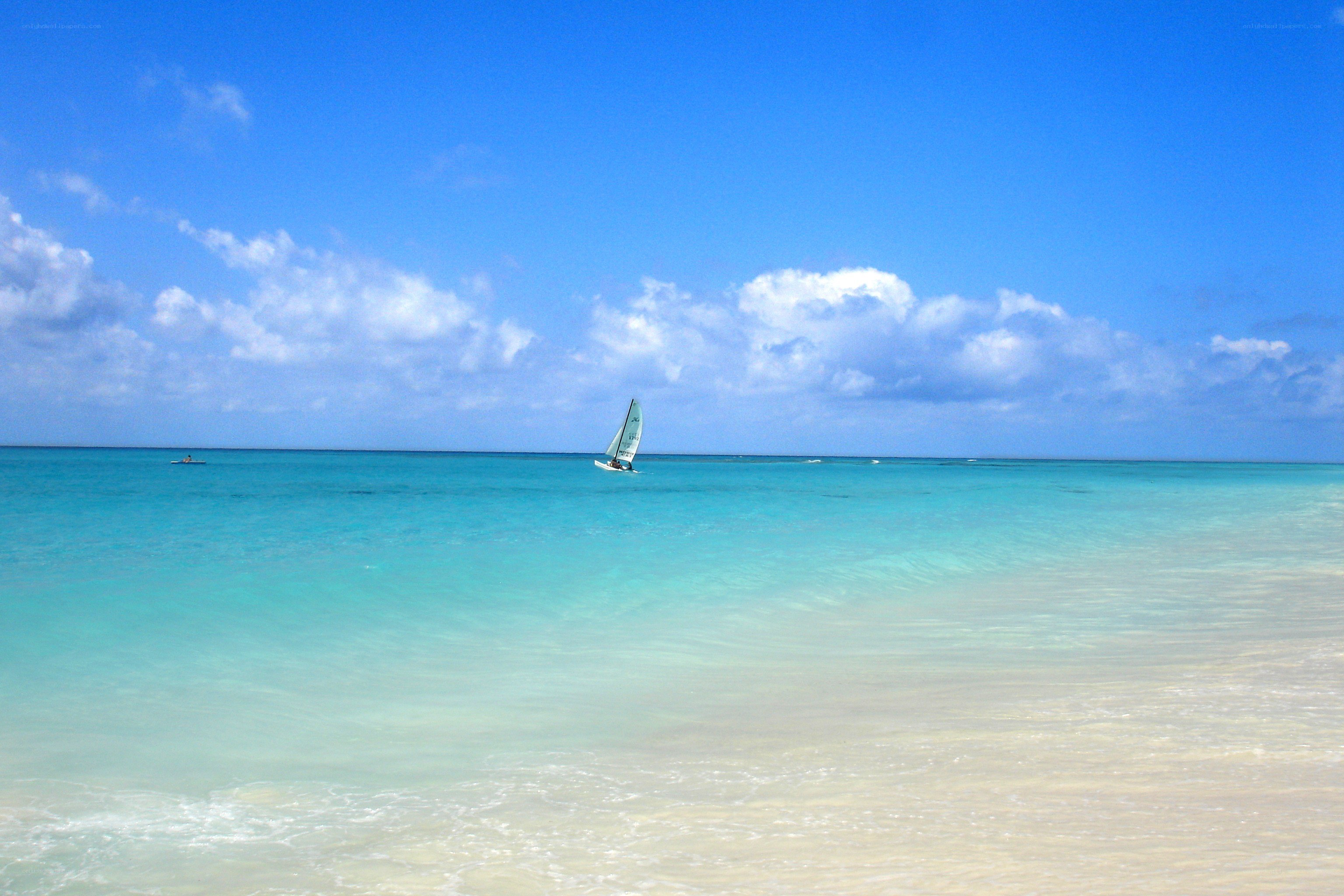 Sailboat on turquoise sea