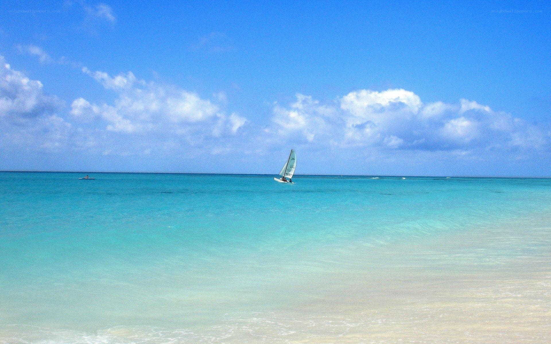 Sailboat on turquoise sea