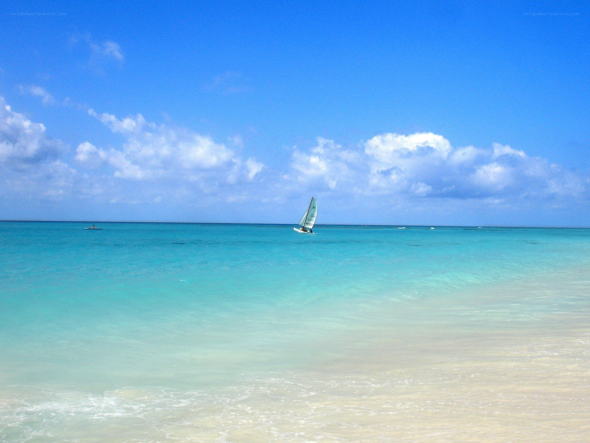 Sailboat on turquoise water