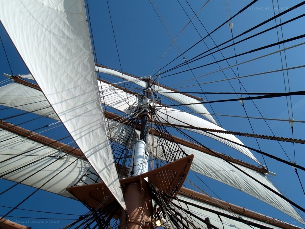 sailboat rigging against blue sky