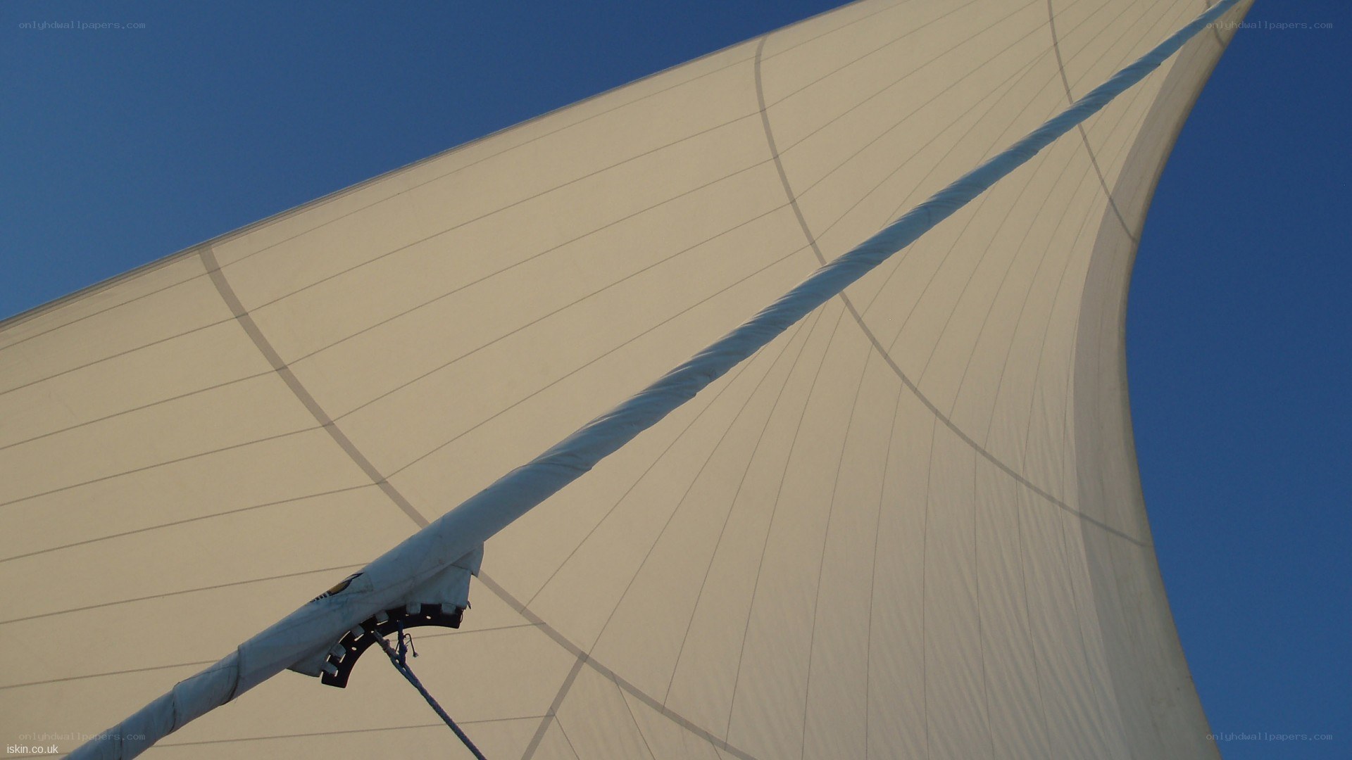 sailboat sail against blue sky