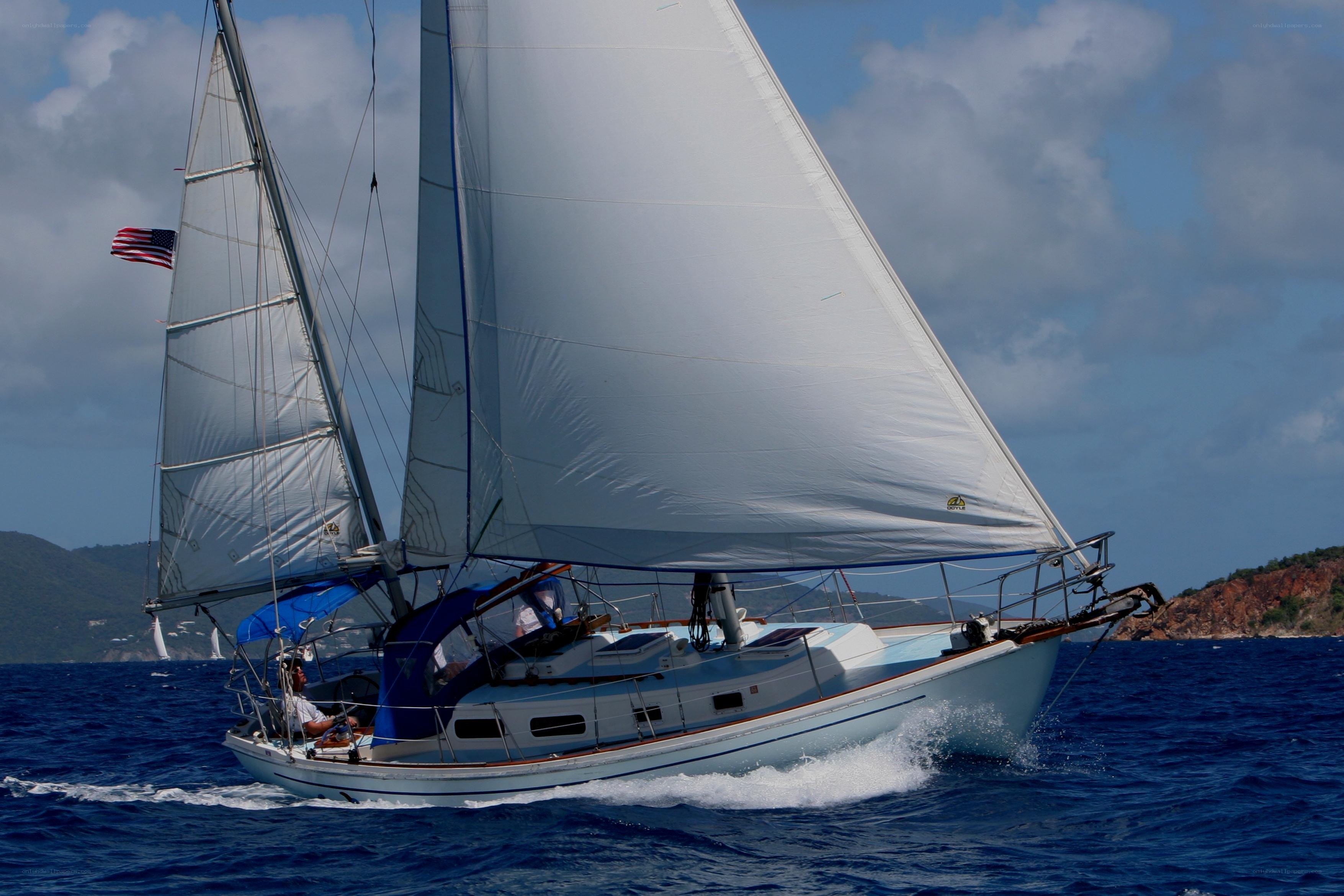 Sailboat sailing on blue sea