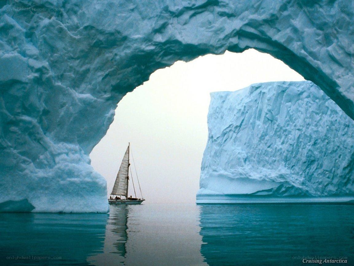 Sailboat through ice arch