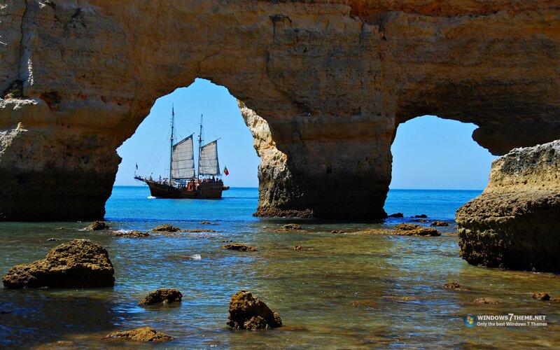 Sailboat Through Rock Arch