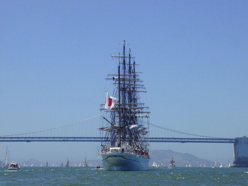 Sailboat under a bridge