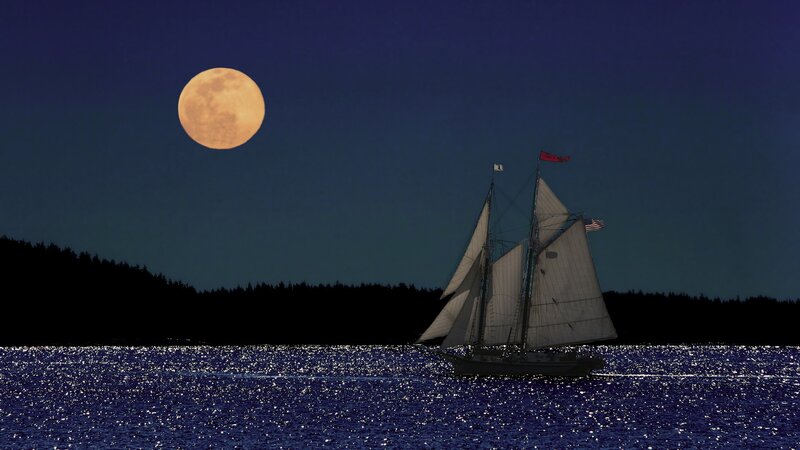 Sailboat under a full moon
