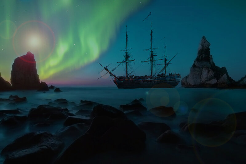 Sailboat under aurora borealis