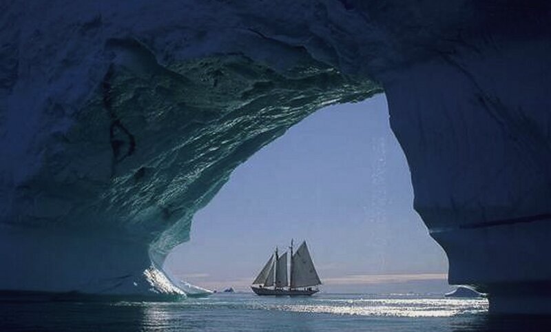Sailboat under Ice Arch — Blue, Serene, Winter