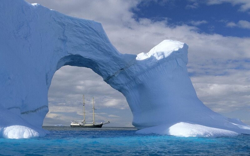 Sailboat under Iceberg Arch — Blue, Afternoon