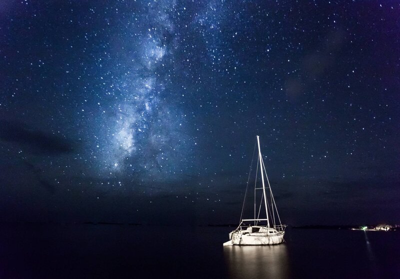 Sailboat under starry sky