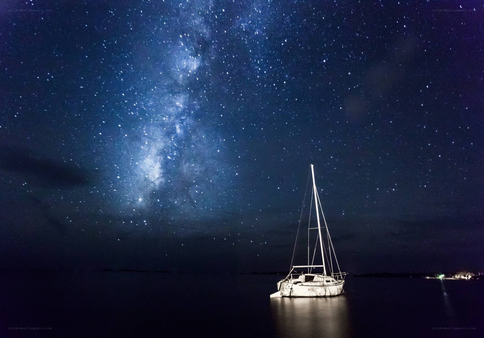 Sailboat under starry sky
