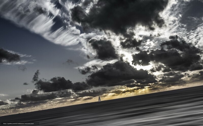 Sailboat under stormy sky