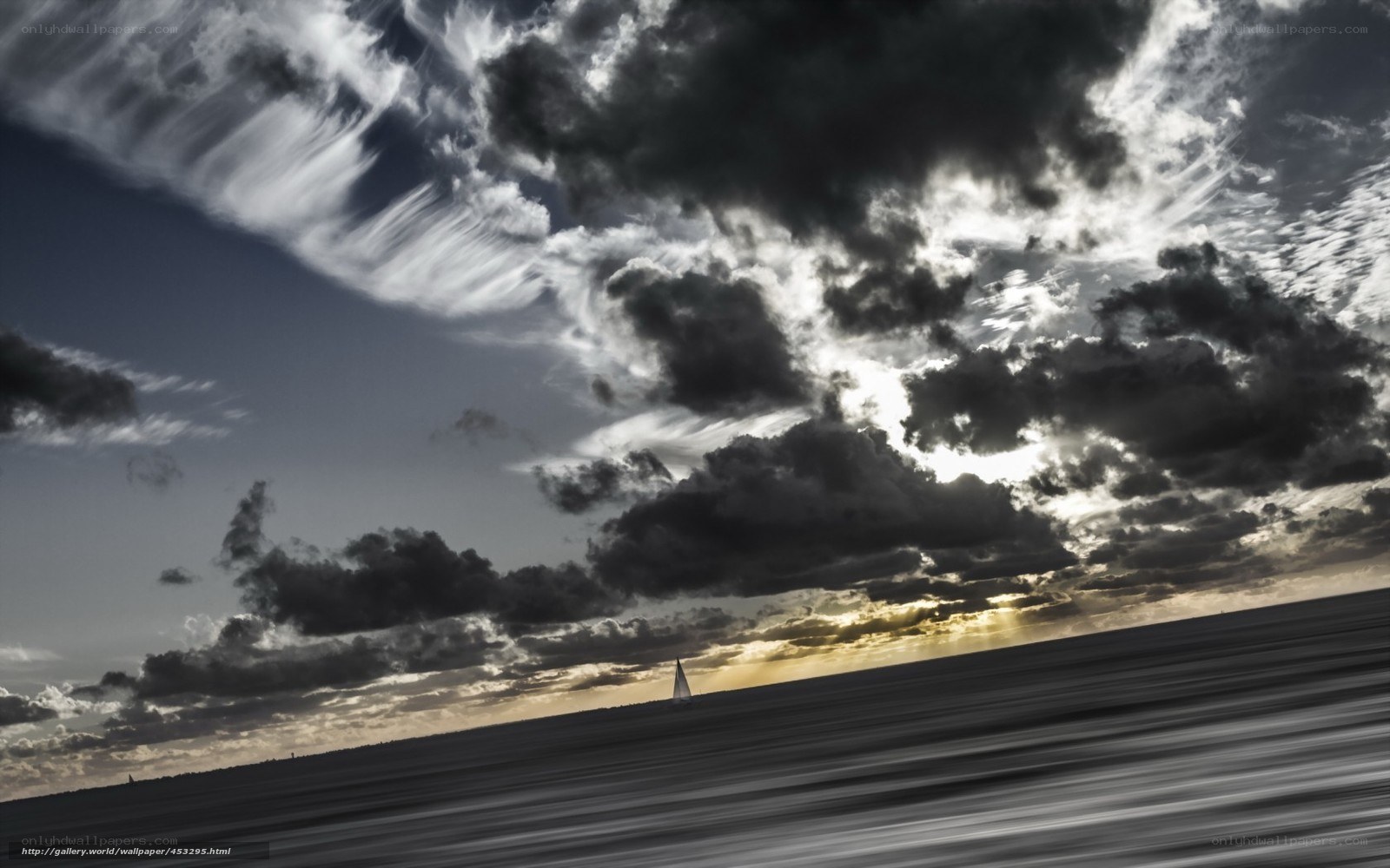 Sailboat under stormy sky