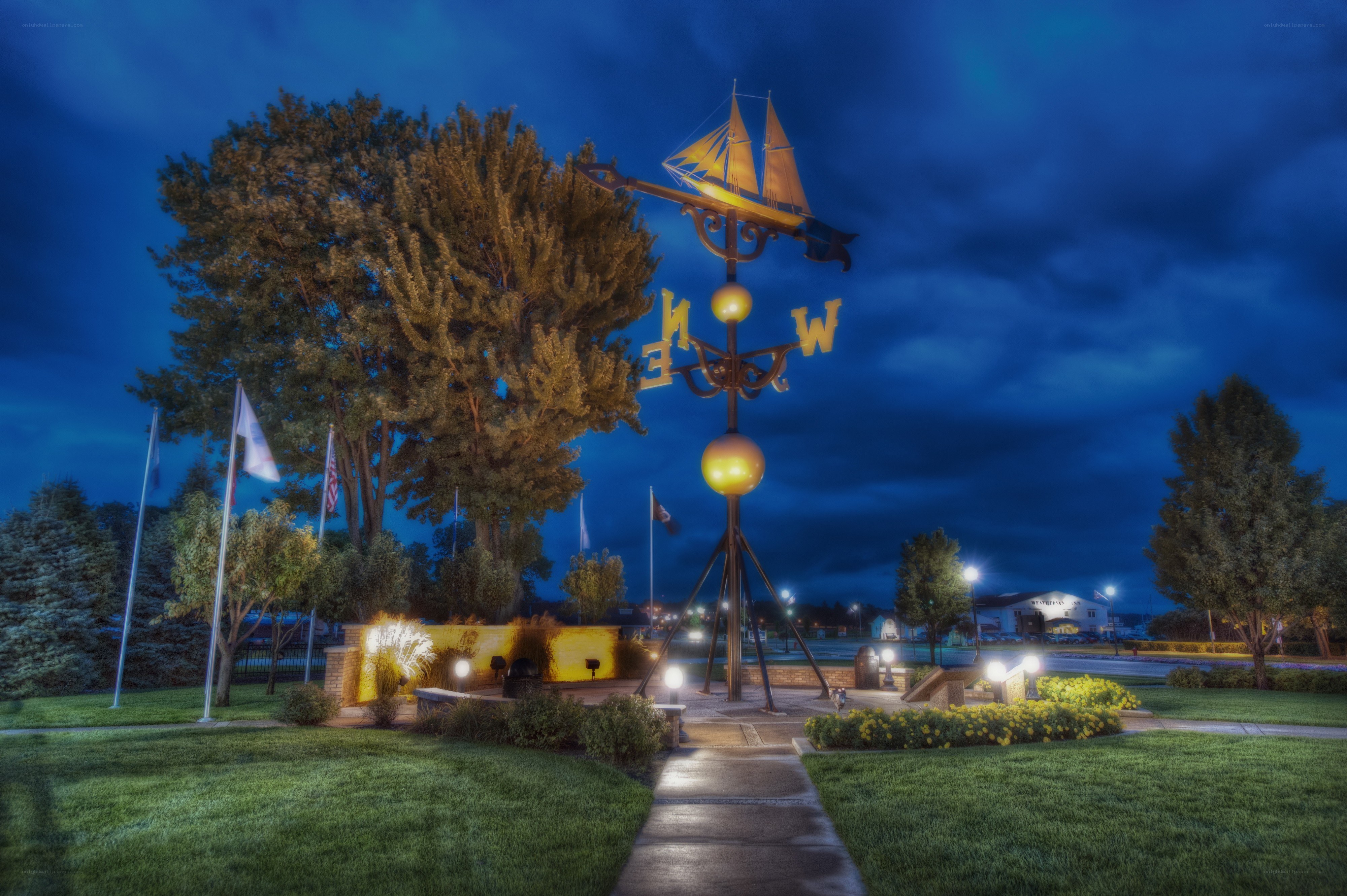 Sailboat weathervane at dusk