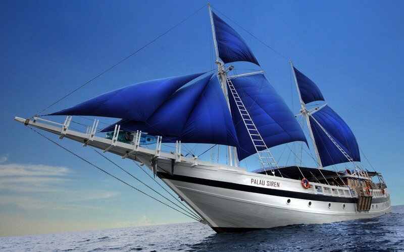 Sailboat with blue sails