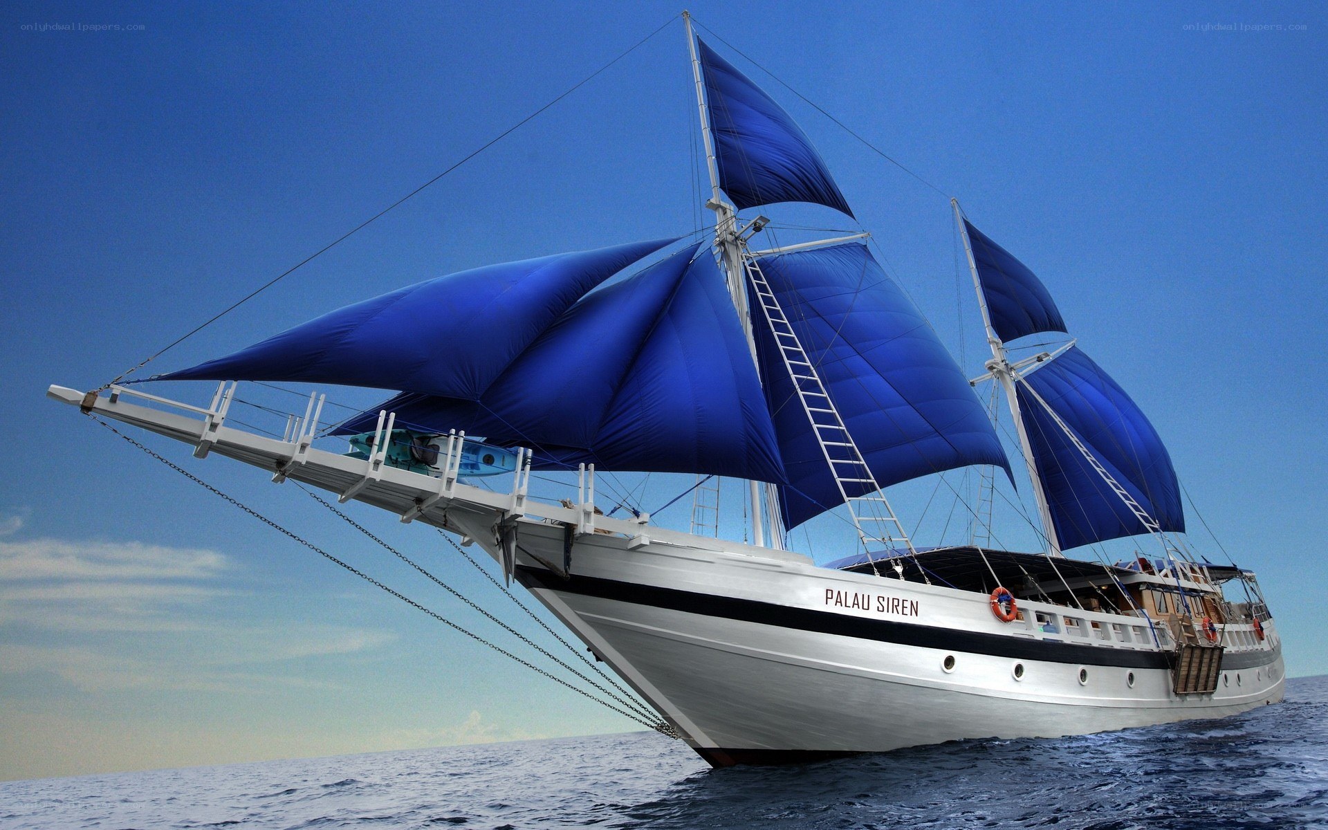 Sailboat with blue sails