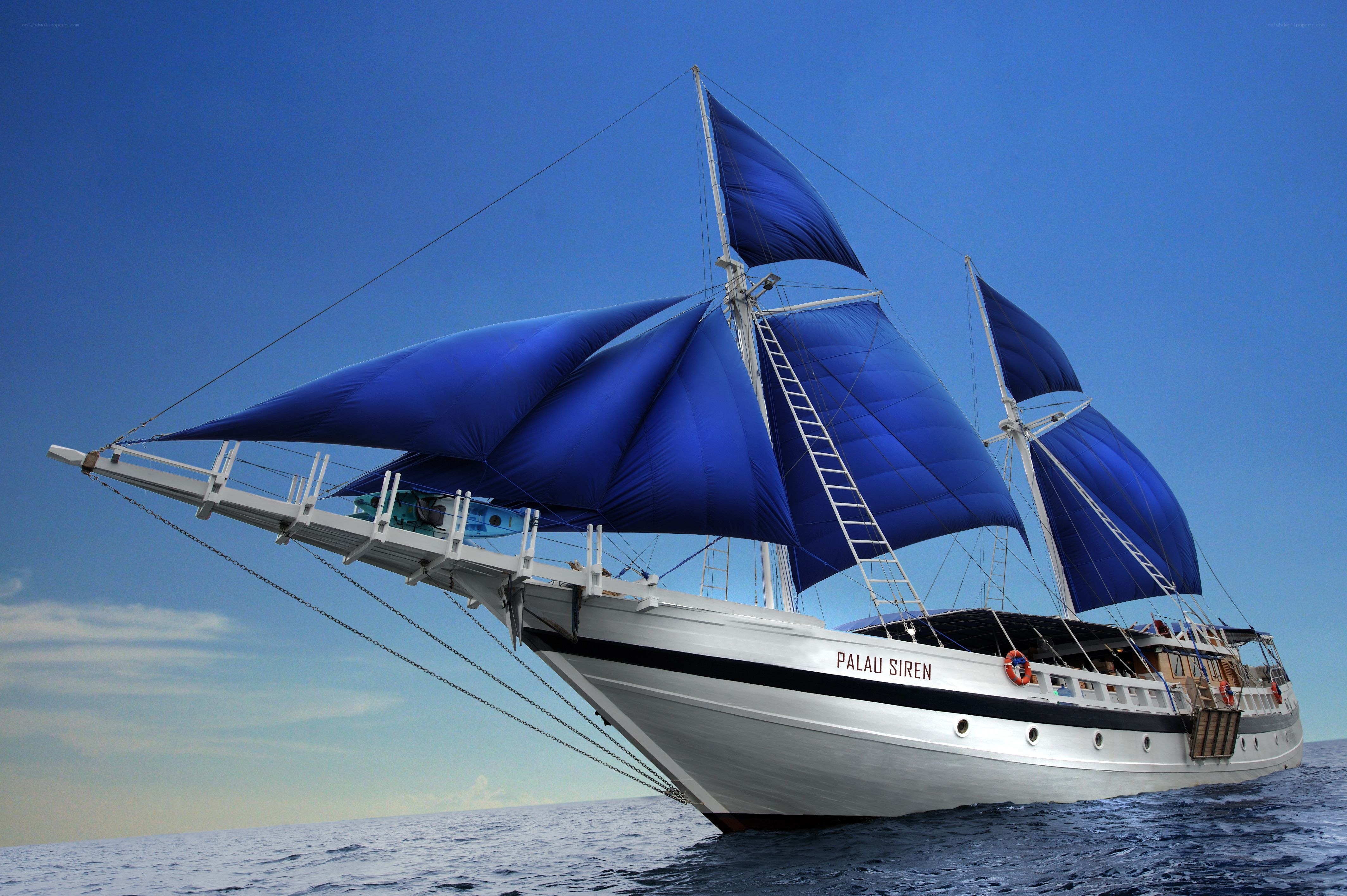 Sailboat with blue sails