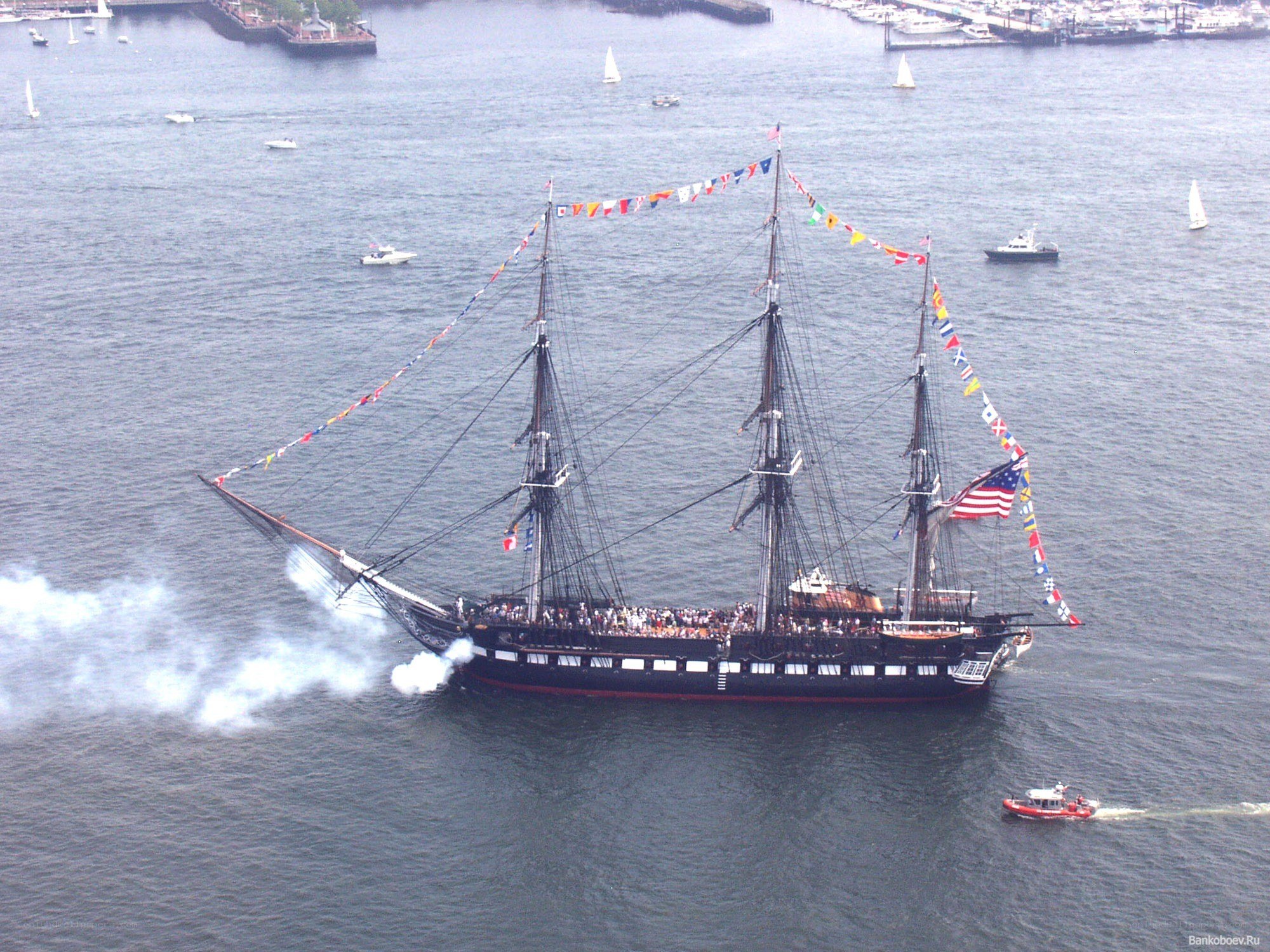 Sailboat with cannon smoke