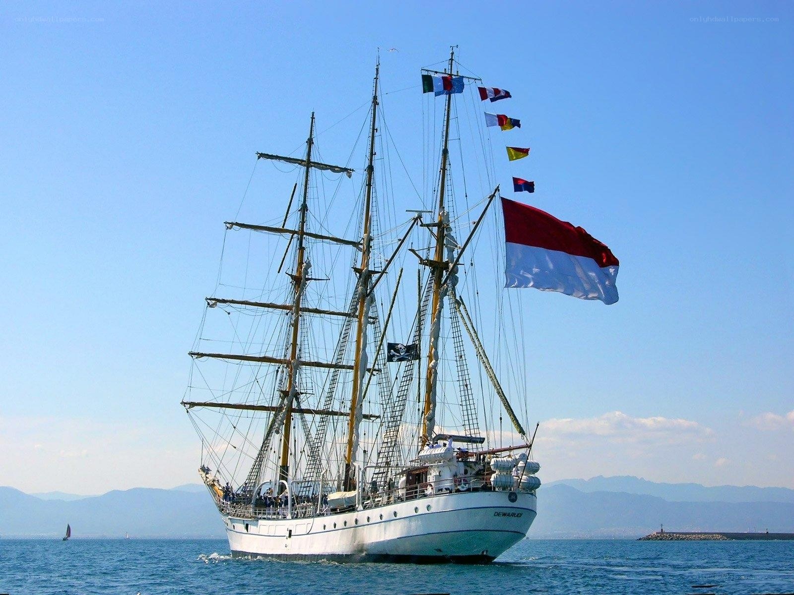 Sailboat with flags on the sea