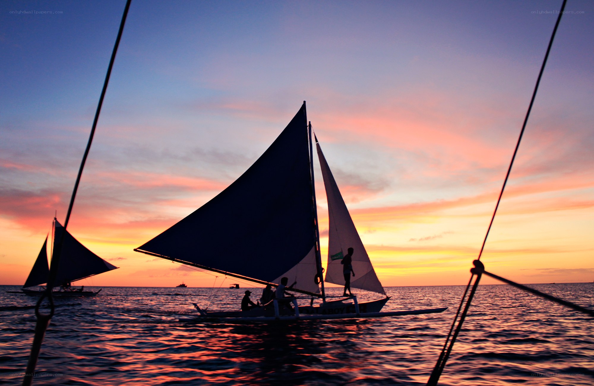 Sailboats at sunset