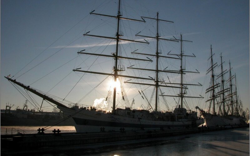 sailboats at sunset in harbor