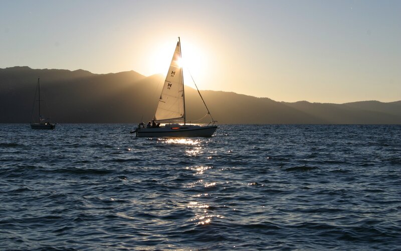 Sailboats at sunset on a lake