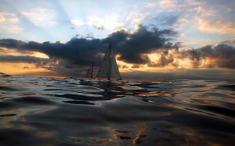 Sailboats at sunset on the sea