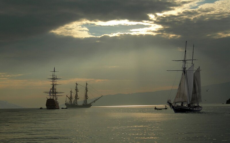 Sailboats at sunset on the water