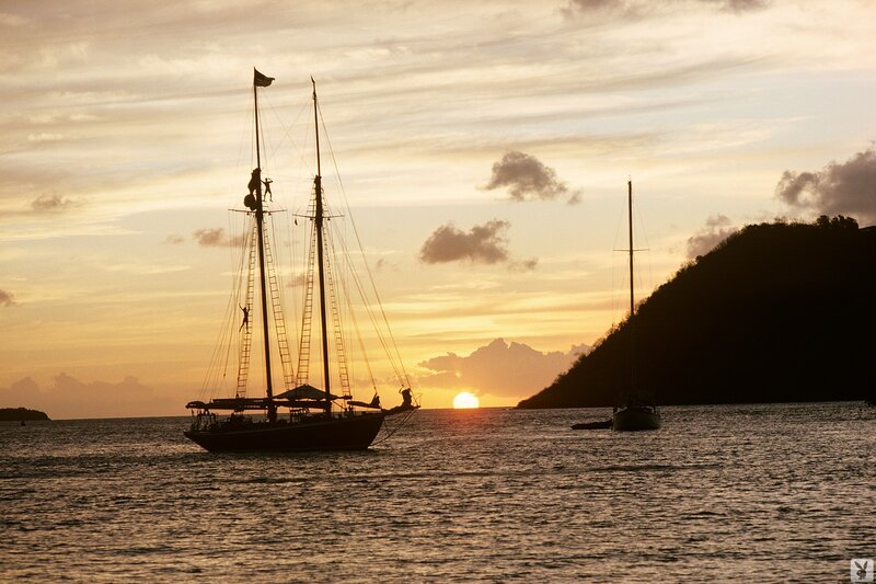 Sailboats at sunset on the water