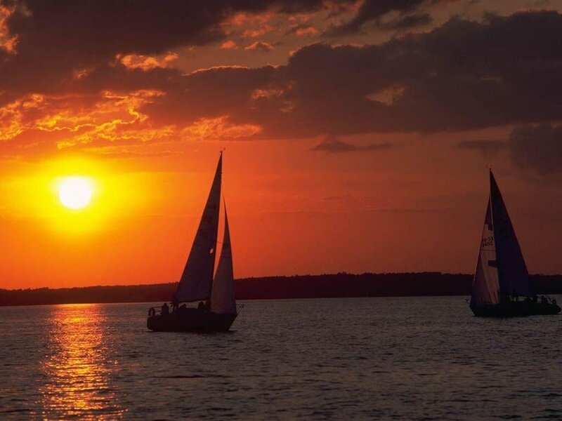 Sailboats at sunset on the water